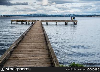 A view of a pier on Lake Washington in Seattle. Bellevue can be seen in the disttance.