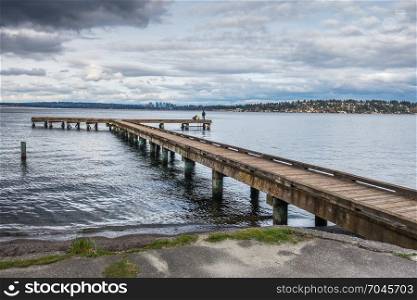 A view of a pier on Lake Washington in Seattle. Bellevue can be seen in the disttance.