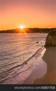 A view of a Praia da Rocha in Portimao during sunset, Algarve region, Portugal