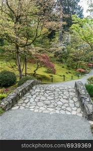 A view of a rock bridge at a garden in Seattle, Washington.