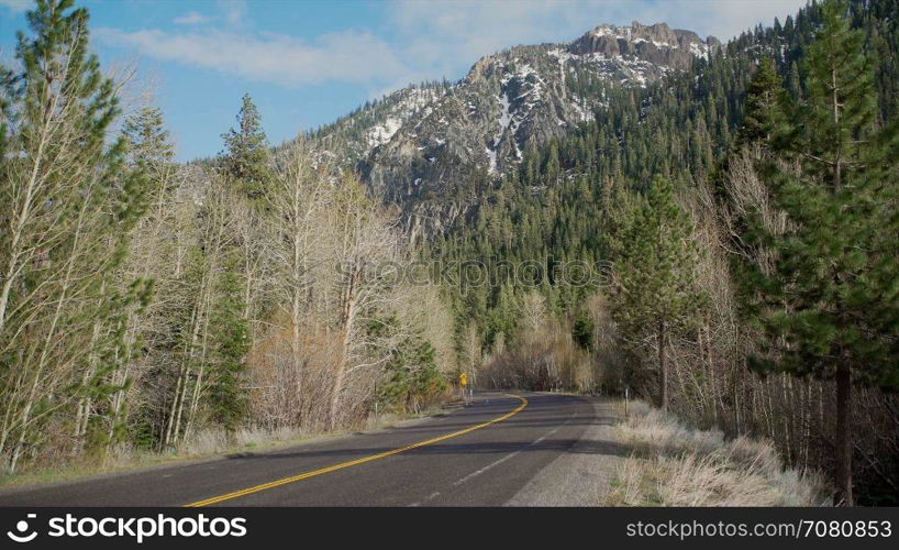 A view of a Sierra Nevada Mountain range road in spring