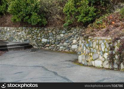 A view of a stone wall at Lincoln Park in West Seattle, Washington.