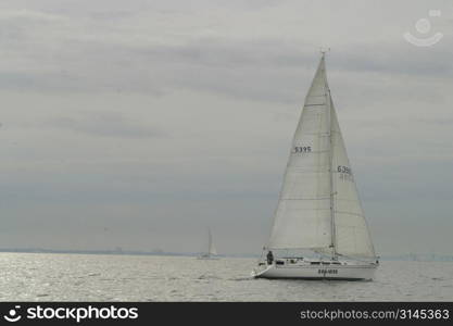 A view of a yacht from on board another in a race. Melbourne 2003 Ewing