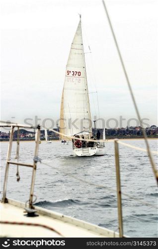 A view of a yacht from on board another in a race. Melbourne 2003 Ewing