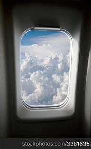 A view of clouds from an airplane window.