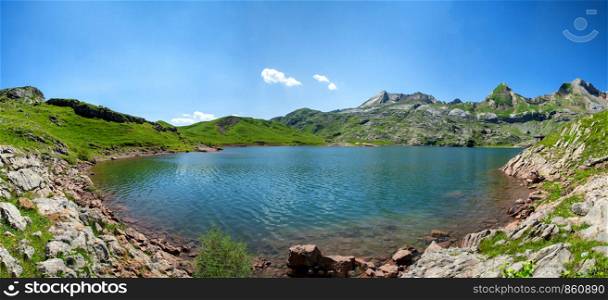 a view of lake Estaens in the Pyrenees mountains