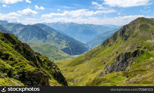 a view of Pyrenees mountains with cloudy blue sky