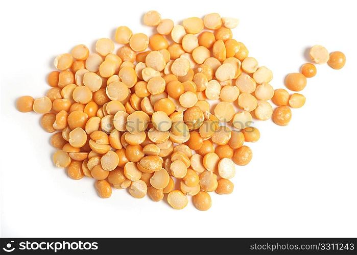 A view of split peas on a white background seen from above with a light shadow