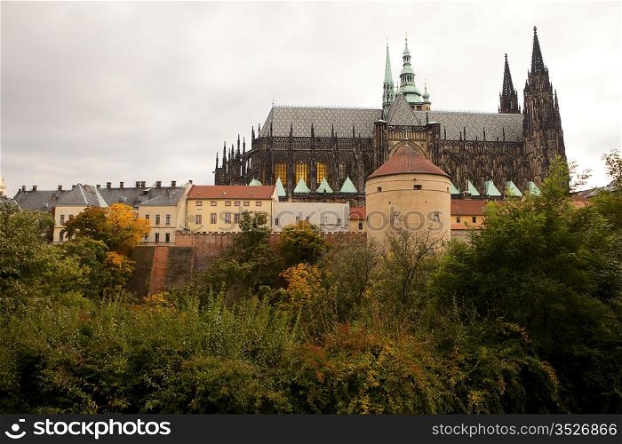 A view of the back of Prague Castle with the imposing Gothic-style architecture of St. Vitus Cathedral.
