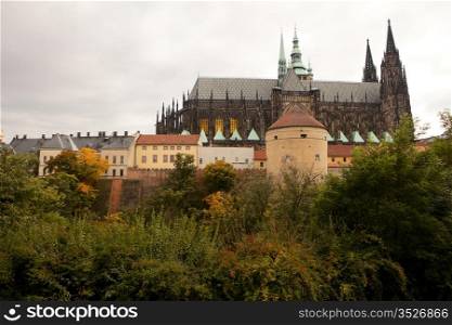 A view of the back of Prague Castle with the imposing Gothic-style architecture of St. Vitus Cathedral.