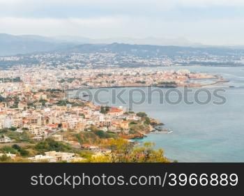 A view of the old town and the Venetian harbor of Chania with the height.. Chania. Aerial view from the mountain top.