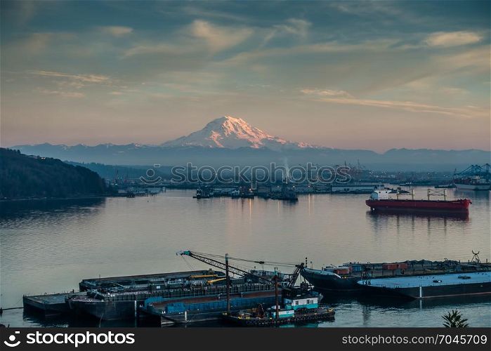 A view of the Port of Tacoma and Mount Rainier at sunset.