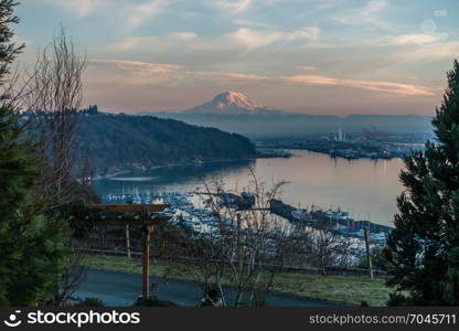 A view of the Port of Tacoma and Mount Rainier at sunset.
