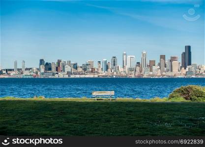 A view of the Seattle skyline with a bench.