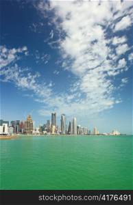 A view of the skyline of the business district of Doha, Qatar, seen from offshore on a cloudy day in Feb, 2011.