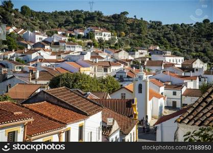 a view of the Town of Belver with the Igreja de nossa snehora da visitacao at the Rio Tejo in Alentejo in  Portugal.  Portugal, Belver, October, 2021