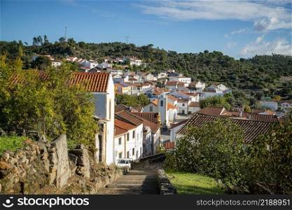 a view of the Town of Belver with the Igreja de nossa snehora da visitacao at the Rio Tejo in Alentejo in  Portugal.  Portugal, Belver, October, 2021