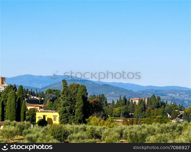 A view of the Tuscan hills. Summer in Tuscany, Apennines. Travel and nature concept.. A view of the Tuscan hills.