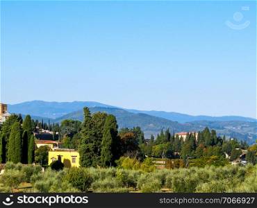 A view of the Tuscan hills. Summer in Tuscany, Apennines. Travel and nature concept.. A view of the Tuscan hills.