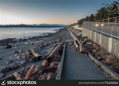 A view of the West Seattle shoreline with the Olympic Mountains in the distance.