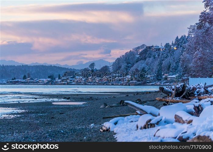 A view of Three Tree Point in Burien, Washington. It is evening on a winter day.