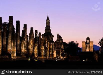 A view of Wat Mahathat at night in Sukhothai Historical Park, Thailand