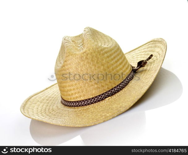 a vintage straw hat on white background