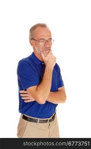 A waist up image of a middle age man in a blue t-shirt standing isolatedfor white background.