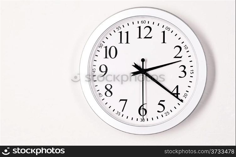 A wall clock says 2:20