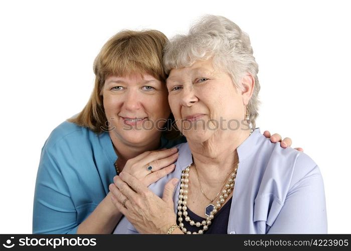 A warm loving portrait of an adult daughter and her elderly mother. Isolated on white.