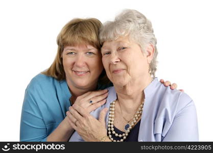 A warm loving portrait of an adult daughter and her elderly mother. Isolated on white.