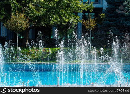 A water fountain sprinkling water in the view