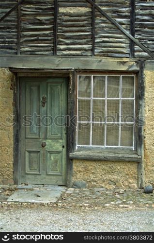 A Weathered Aged Stone House. Weathered Green Door With an Aged Stone House Home Related