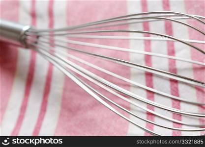 A whisk in a horizontal composition