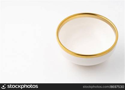A white and brown ceramic bowl on a white background. White and brown ceramic bowl on a white background