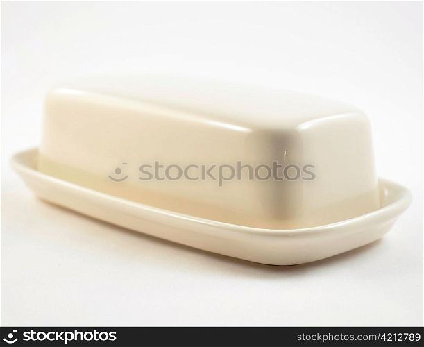 a white butter dish , close up shot