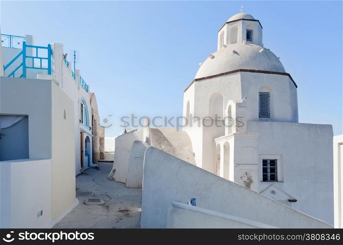 A white church in Fira on Santorini island, Greece. Characteristic architecture and famous tourist attraction