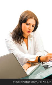 a white collar worker dressing a white shirt sitting at her desk working with a computer and having an expressive face