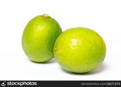 A whole fresh lime isolated on a white background.. Lime
