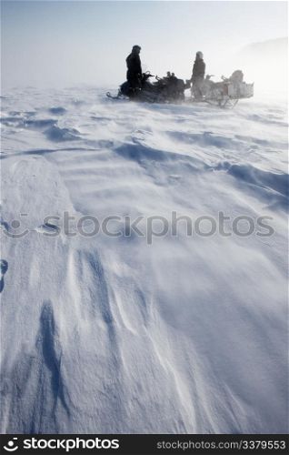 A wild winter storm in a barren mountain landscape