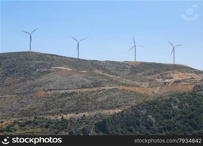 A wind mill farm on top of the mountain