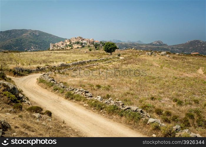 A winding dirt track leads to the picturesque village of Sant&rsquo;Antonino in the Balagne region of Corsica