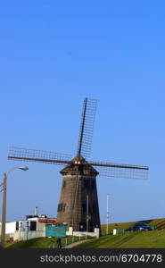 A windmill at sunset in Europe