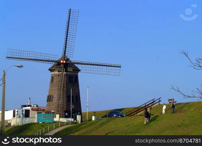 A windmill at sunset in Europe