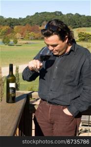 A winemaker sampling the finished product