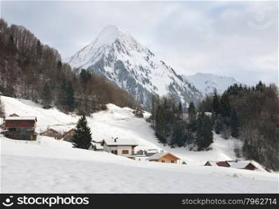 A winter alpine scene, on a cold overcast day, near Mellau, in Austria
