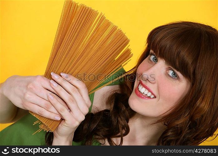 A woman about to cook pastas.