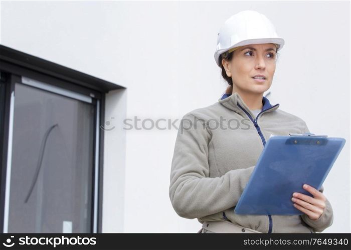 a woman architect checking list