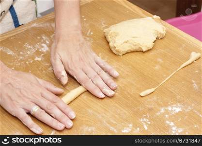 a woman baker kneading bread
