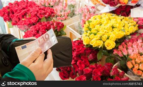 A woman buying flowers at a market